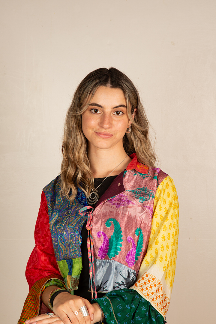 Gabriella Tobler wearing a colorful patchwork jacket